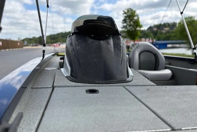 Slide: The Image of 2017 G3 Sportsman 1710 Vinyl boat interior with seating and console, outdoors. - 51