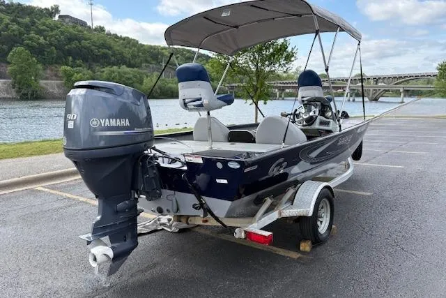 Slide: The Image of 2017 G3 Sportsman 1710 Vinyl boat with Yamaha motor, parked by a scenic riverside. - 6