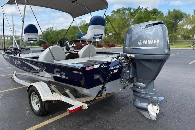 Slide: The Image of 2017 G3 Sportsman 1710 Vinyl boat with Yamaha motor in parking lot. - 7