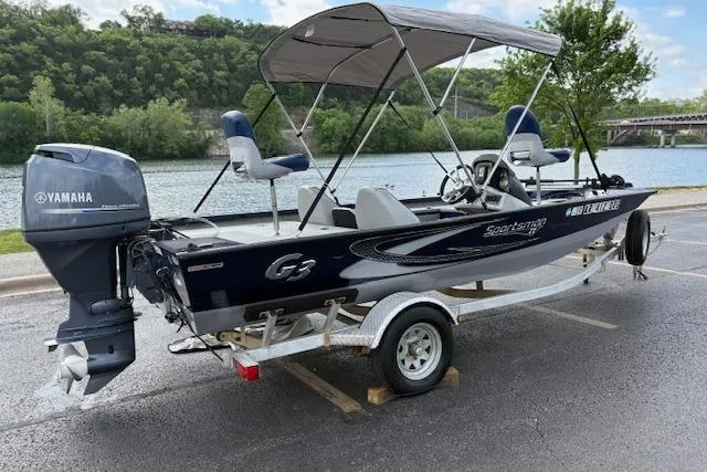 Slide: The Image of 2017 G3 Sportsman 1710 Vinyl boat with Yamaha motor, parked by a scenic river. - 8