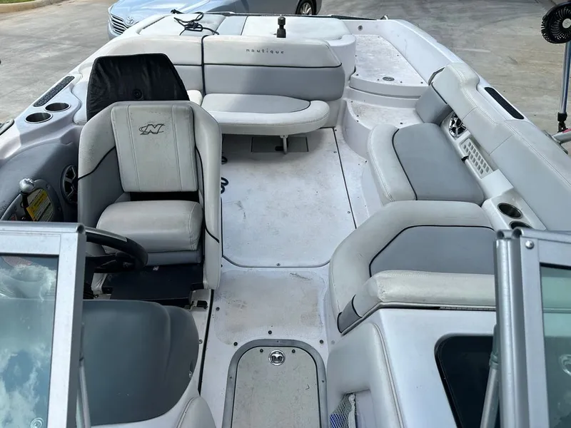 Slide: The Image of Interior of a 2007 Nautique 211 boat with gray seating. - 14