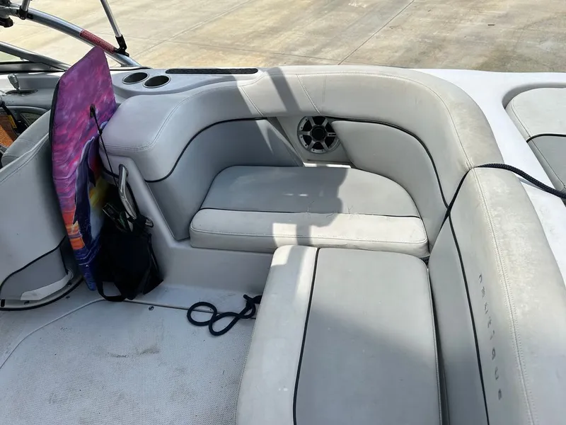 Slide: The Image of Interior of a 2007 Nautique 211 boat with gray seating. - 15