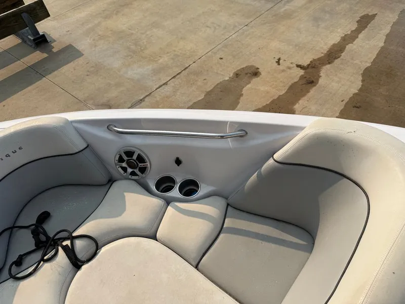 Slide: The Image of Interior of a 2007 Nautique 211 boat with speakers and helm console. - 3