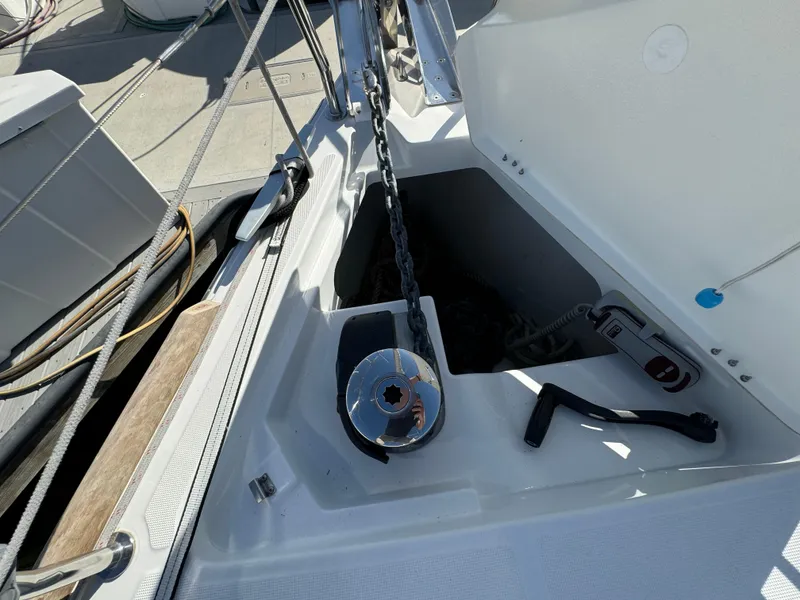 Slide: The Image of Anchor locker of 2021 Beneteau Oceanis 35.1 sailboat with chain and winch. - 20