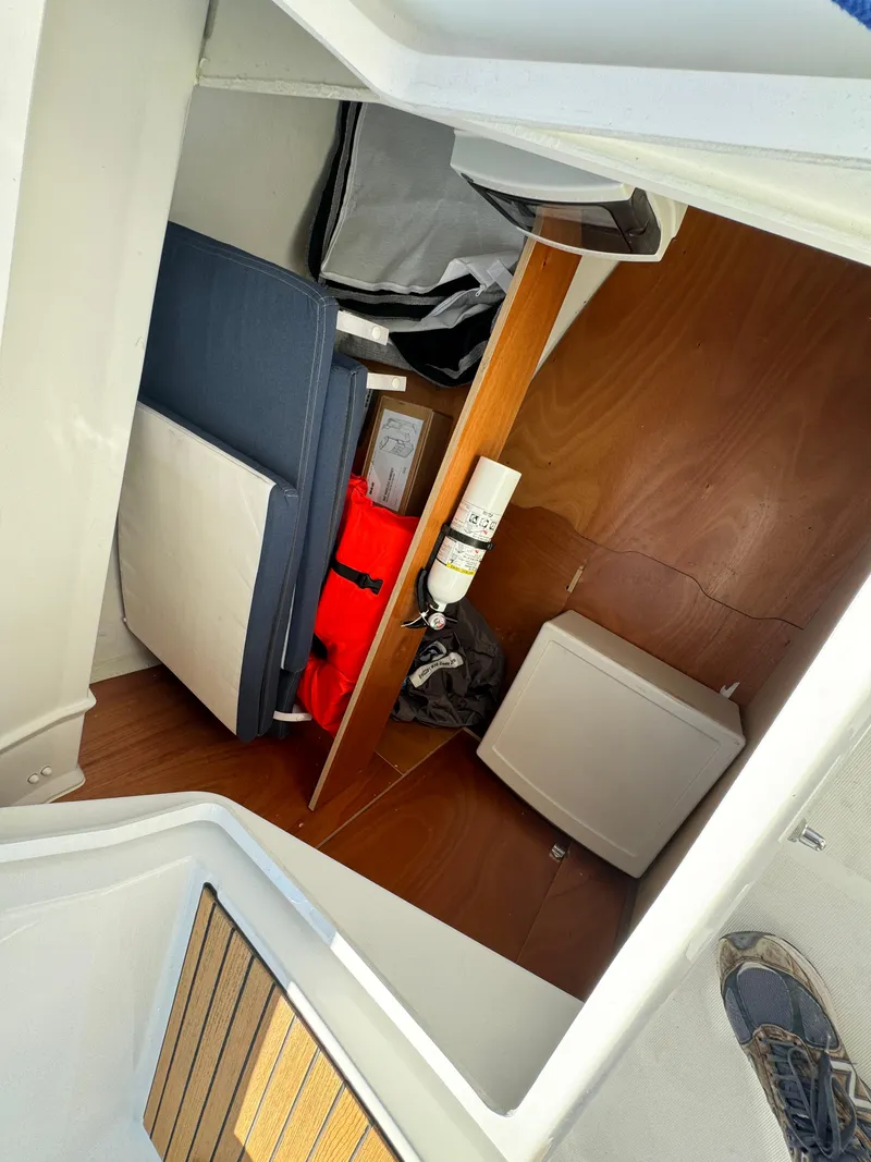 Slide: The Image of Interior cabin of 2021 Beneteau Oceanis 35.1 sailboat with storage and seating. - 33