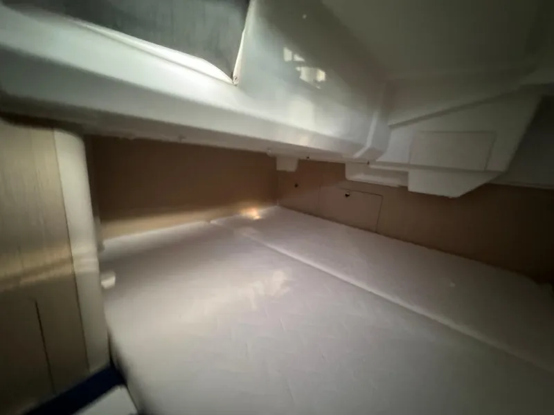 Slide: The Image of Interior cabin of 2021 Beneteau Oceanis 35.1 yacht, featuring a cozy sleeping area. - 38