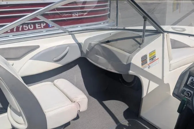 Slide: The Image of 2010 Bayliner 185 Bowrider interior with seating and dashboard, showcasing sleek design. - 6