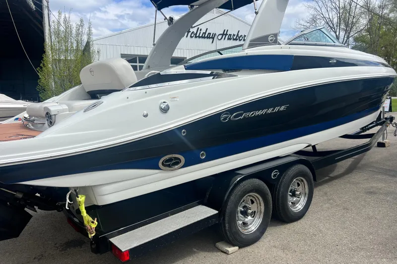 Slide: The Image of 2018 Crownline 285 SS boat on trailer at Holiday Harbor marina. - 4