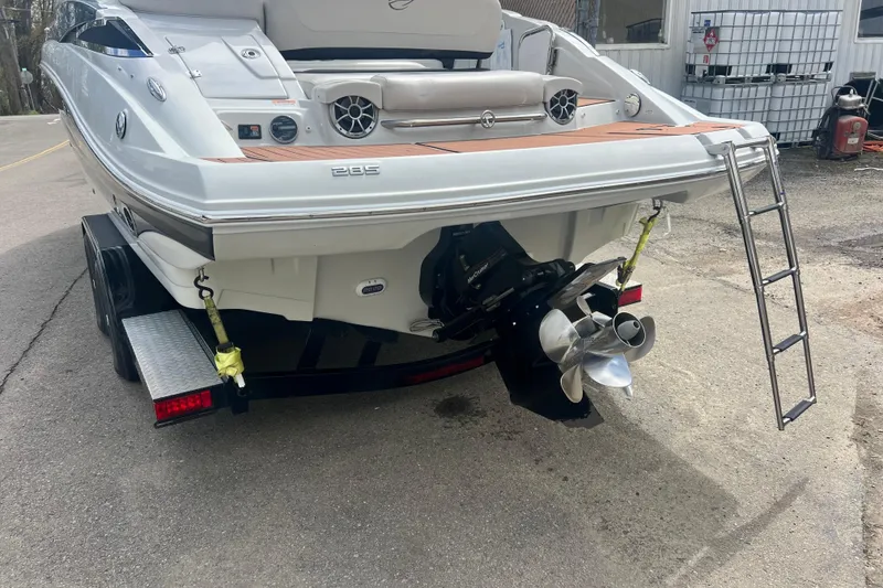 Slide: The Image of 2018 Crownline 285 SS boat rear view with ladder and propeller. - 7