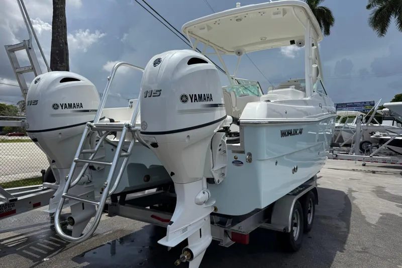 Slide: The Image of 2026 World Cat 230 SD boat with twin Yamaha 115 engines on a trailer. - 4