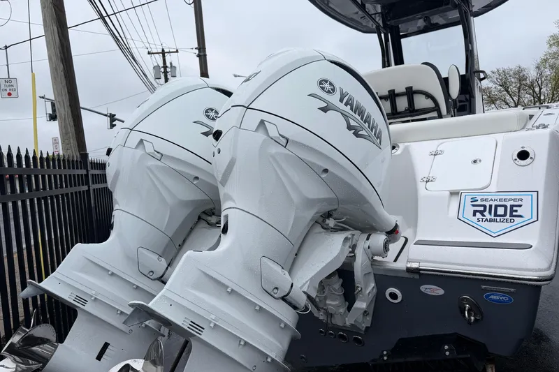 Slide: The Image of 2026 Tidewater 256 LXF boat with dual Yamaha engines and Seakeeper Ride stabilization. - 3