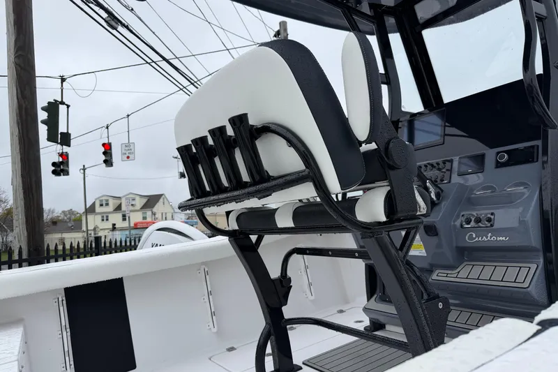Slide: The Image of 2026 Tidewater 256 LXF boat interior with helm seat and control panel. - 4