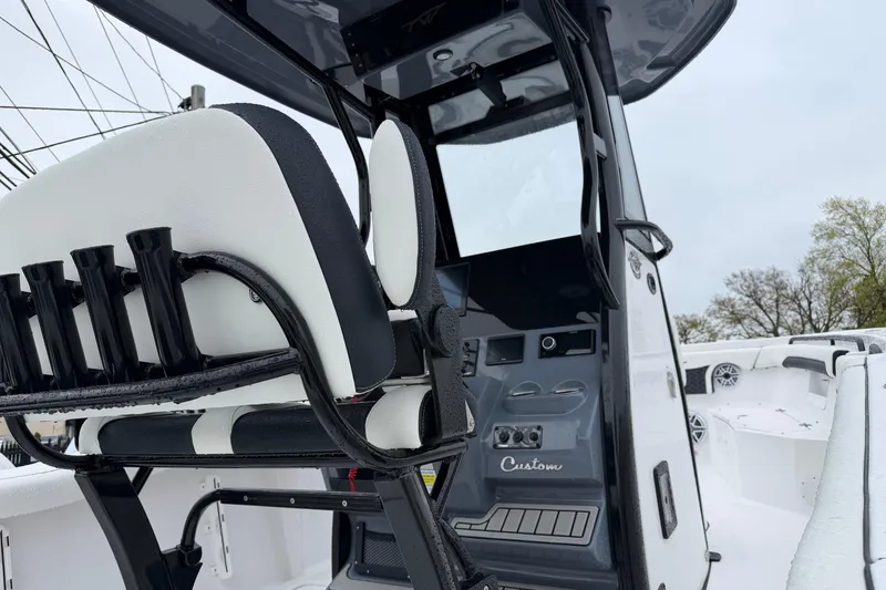 Slide: The Image of 2026 Tidewater 256 LXF boat interior with sleek seating and modern console design. - 5
