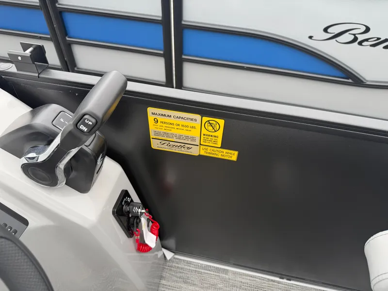 Slide: The Image of 2026 Bentley Pontoons BOLT 200 control panel and capacity warning. - 10