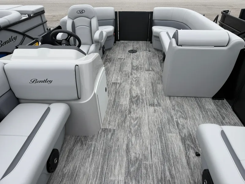 Slide: The Image of Interior of 2026 Bentley Pontoons BOLT 200 with gray seating and steering wheel. - 6