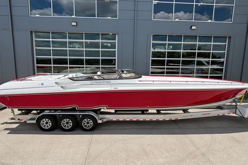 The Image of 2007 Fountain 42 Lightning speedboat in red and white on a trailer. - 1