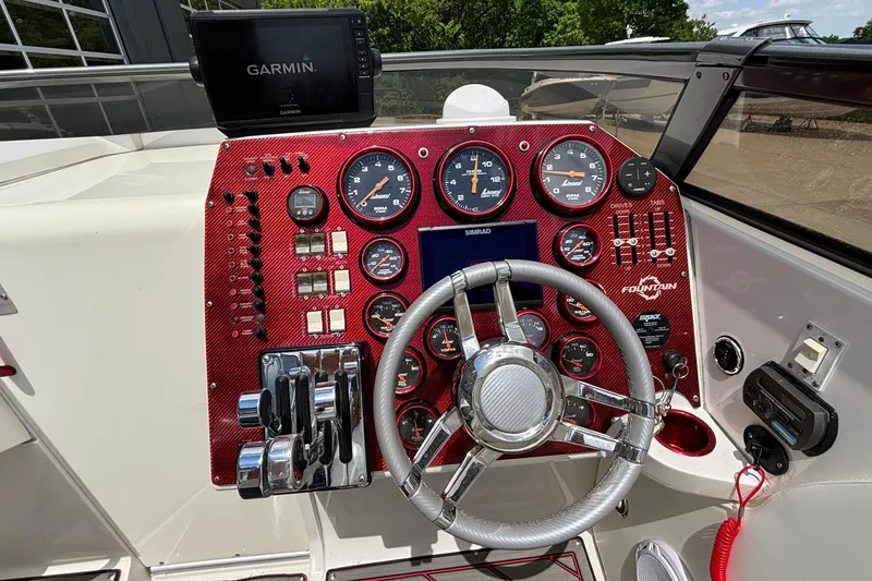 Slide: The Image of Dashboard of a 2007 Fountain 42 Lightning boat with gauges and Garmin GPS. - 27