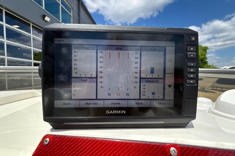Slide: The Image of Garmin display on 2007 Fountain 42 Lightning boat showing engine metrics under blue sky. - 31