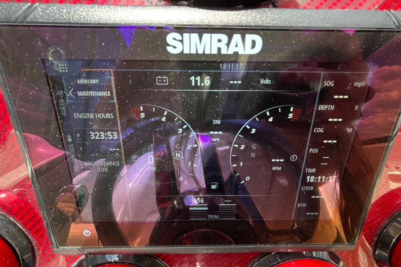 Slide: The Image of Simrad display on 2007 Fountain 42 Lightning showing engine hours and navigation data. - 32