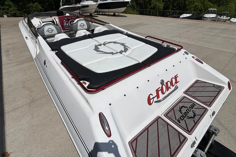 Slide: The Image of 2007 Fountain 42 Lightning speedboat with custom G-Force branding, docked on concrete. - 4