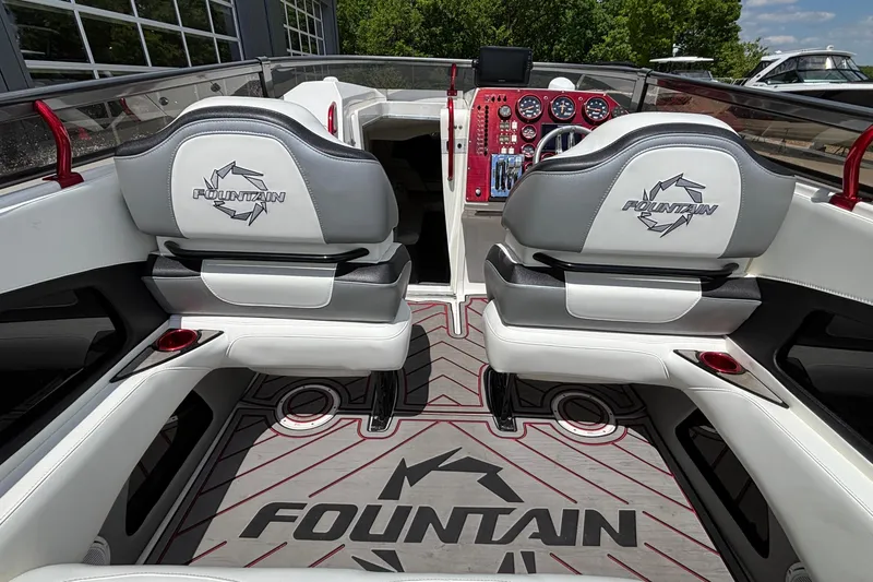 Slide: The Image of Interior of a 2007 Fountain 42 Lightning boat with branded seating and dashboard. - 7