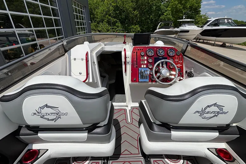 Slide: The Image of Interior of a 2007 Fountain 42 Lightning boat with sleek dashboard and seating. - 8