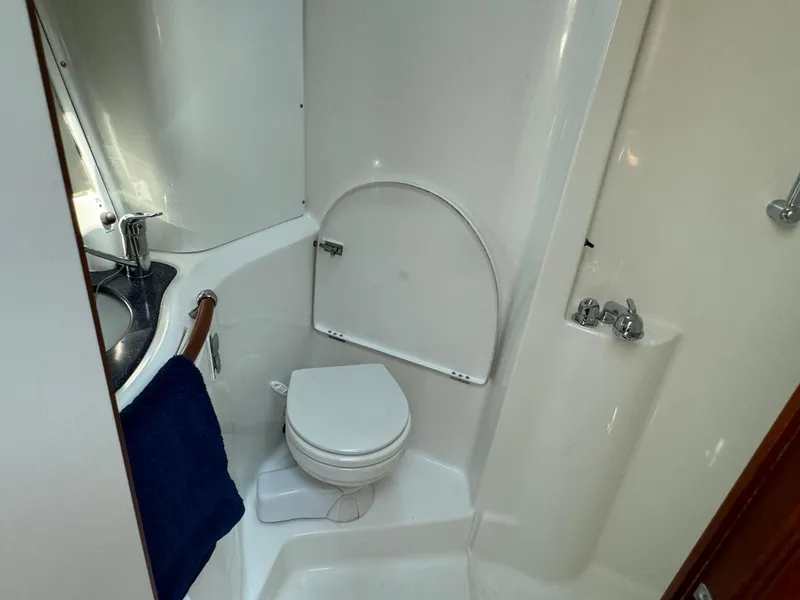 Slide: The Image of Bathroom of 2001 Beneteau Oceanis Clipper 473 yacht with toilet and sink. - 21