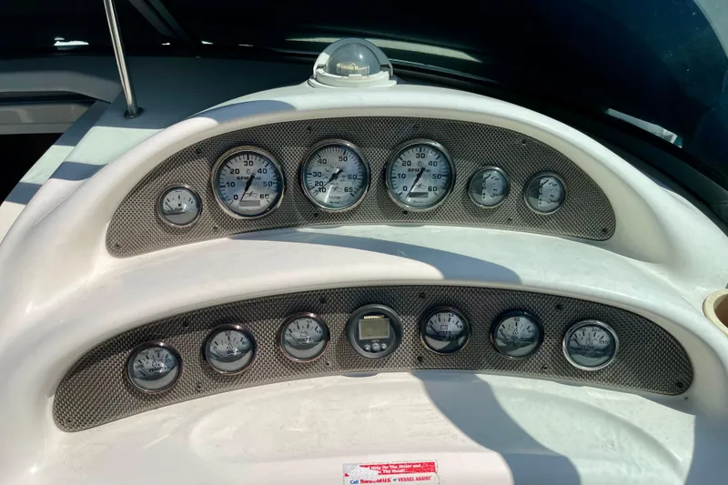 Slide: The Image of Dashboard of a 2000 Monterey 302 Cruiser with multiple gauges and controls. - 10