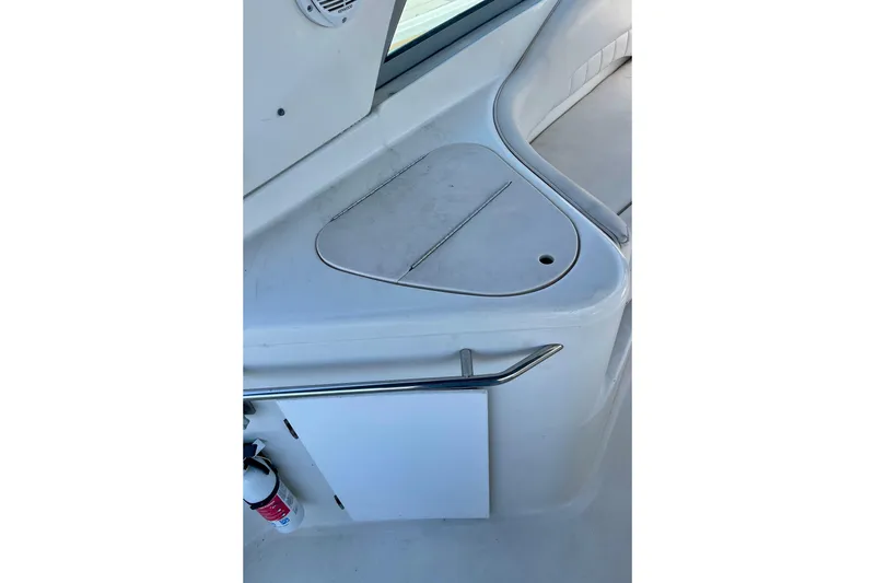 Slide: The Image of Interior view of a 2000 Monterey 302 Cruiser boat, featuring a sleek white design. - 4