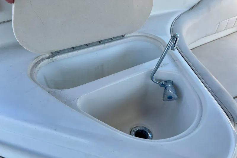 Slide: The Image of Open sink compartment on a 2000 Monterey 302 Cruiser boat. - 5