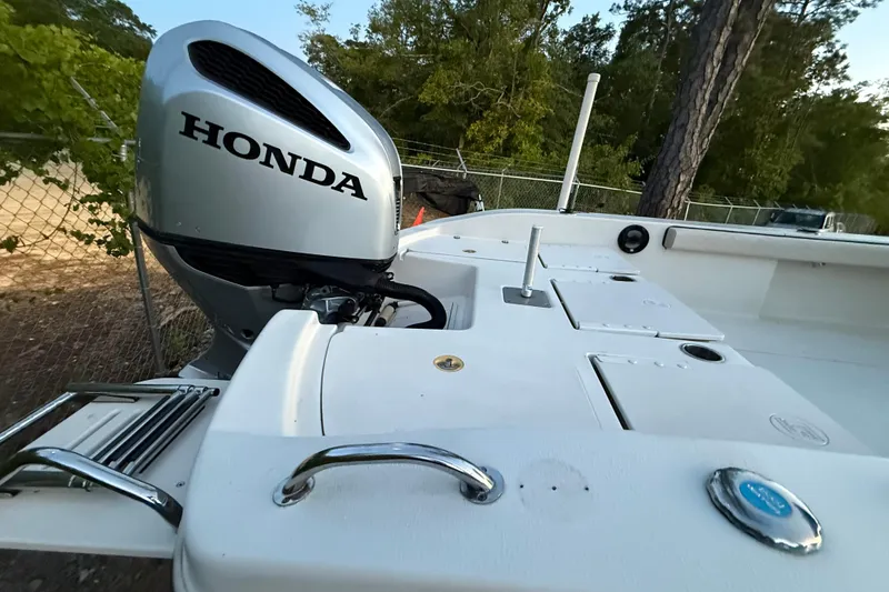 Slide: The Image of 2021 Carolina Skiff 26 Ultra Elite with Honda outboard motor on trailer. - 11
