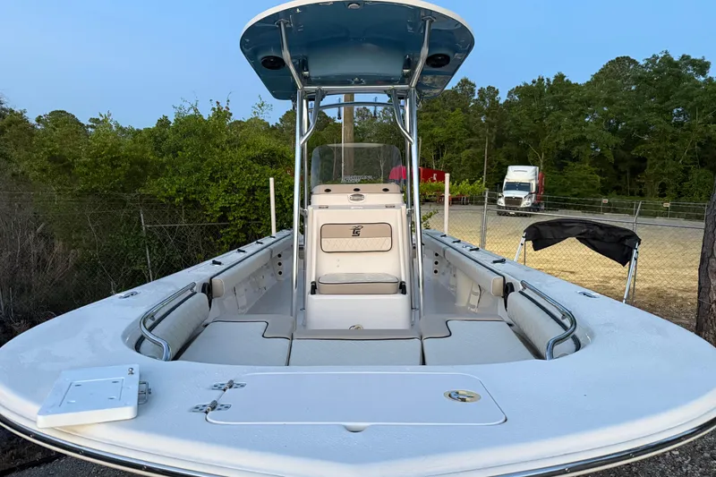 Slide: The Image of 2021 Carolina Skiff 26 Ultra Elite boat interior with seating and Honda outboard motor. - 12