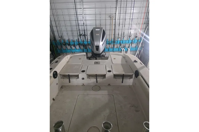 Slide: The Image of 2021 Carolina Skiff 26 Ultra Elite boat on trailer, parked near storage facility. - 2