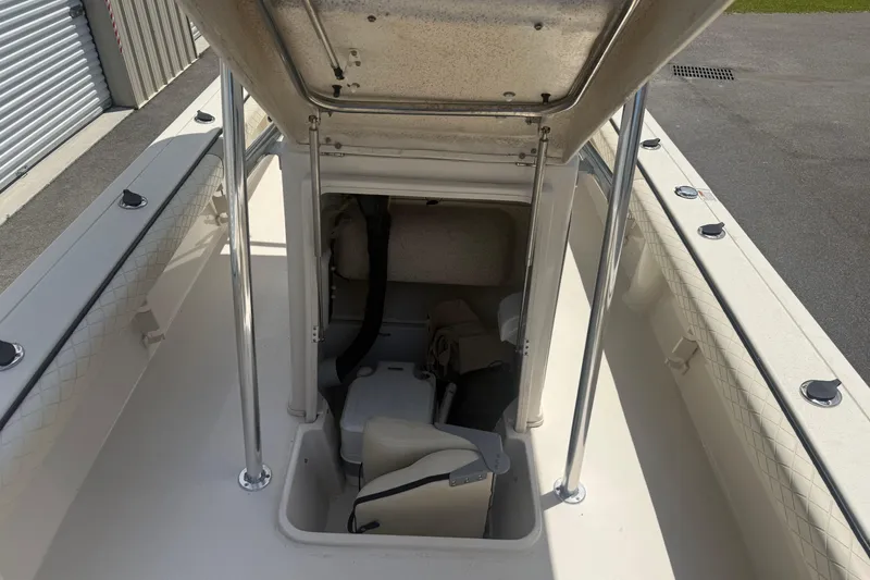 Slide: The Image of 2021 Carolina Skiff 26 Ultra Elite boat interior with open hatch and seating. - 20