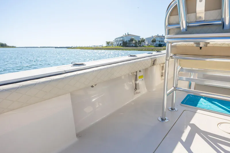 Slide: The Image of 2021 Carolina Skiff 26 Ultra Elite boat interior with waterfront view. - 23