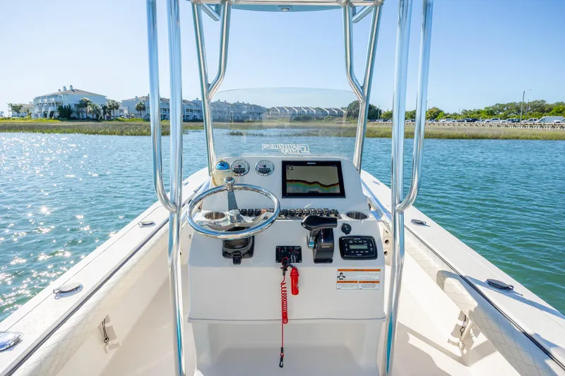 Slide: The Image of Center console of a 2021 Carolina Skiff 26 Ultra Elite boat on water. - 24