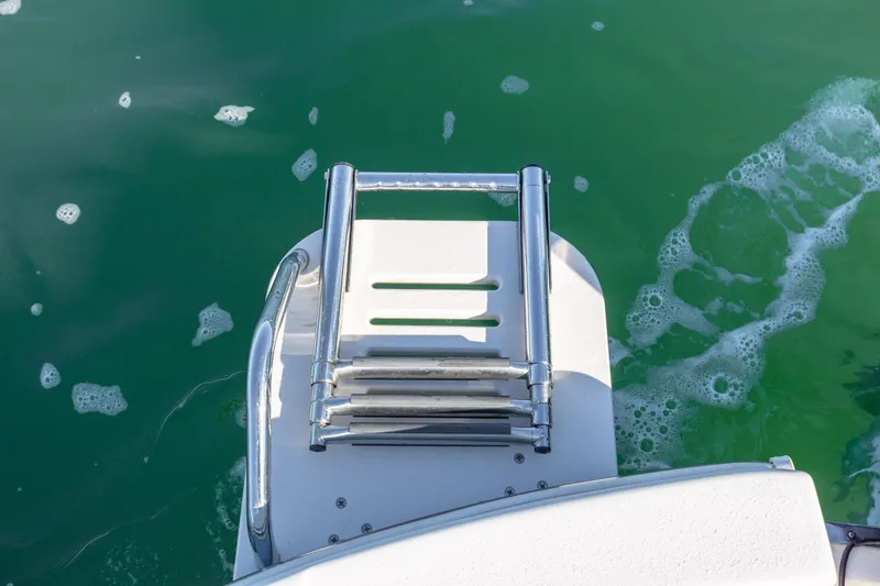 Slide: The Image of Stainless steel boat ladder on 2021 Carolina Skiff 26 Ultra Elite in green water. - 38