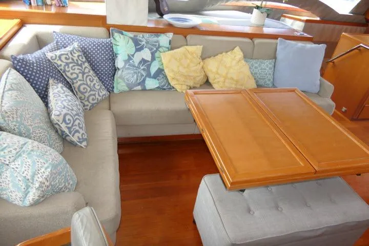 Slide: The Image of Luxurious Tayana Isara 50 yacht interior with cozy cushions and wooden table, 2014 model. - 10