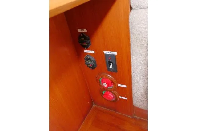 Slide: The Image of Control panel on 2014 Tayana Isara 50 yacht with labeled switches and dials. - 18