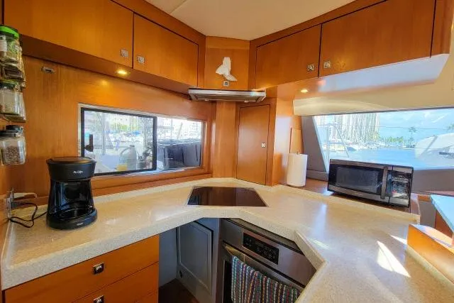 Slide: The Image of Modern kitchen interior of 2014 Tayana Isara 50 yacht with appliances and wooden cabinetry. - 21