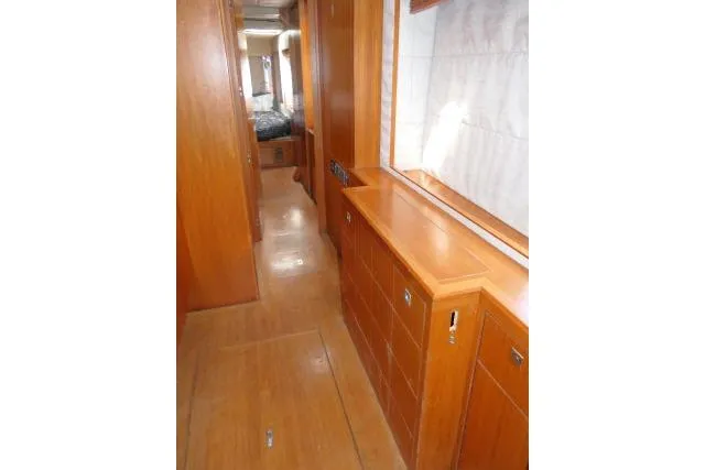 Slide: The Image of Interior hallway of 2014 Tayana Isara 50 yacht with wooden cabinetry and flooring. - 27