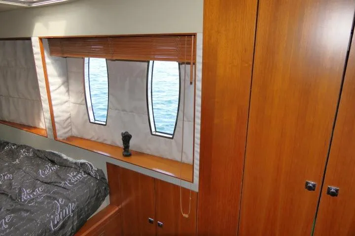 Slide: The Image of Interior of 2014 Tayana Isara 50 yacht with wooden cabinetry and ocean view windows. - 31