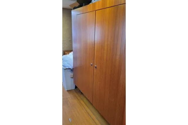 Slide: The Image of Wooden cabinet interior of 2014 Tayana Isara 50 yacht, showcasing sleek design and storage. - 33