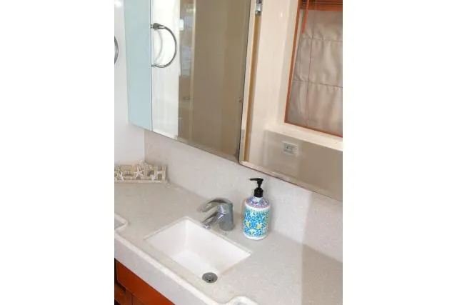 Slide: The Image of Bathroom sink area on 2014 Tayana Isara 50 yacht with soap dispenser and mirror. - 38