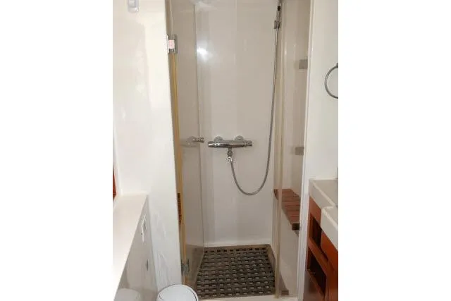 Slide: The Image of Shower area in 2014 Tayana Isara 50 yacht, featuring modern fixtures and wooden accents. - 39