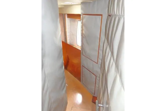 Slide: The Image of Interior hallway of 2014 Tayana Isara 50 yacht with quilted walls and wooden accents. - 41