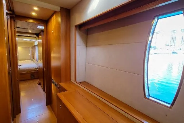 Slide: The Image of Interior of 2014 Tayana Isara 50 yacht with wood paneling and large window. - 43