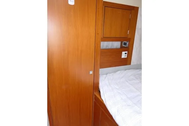 Slide: The Image of Interior cabin of 2014 Tayana Isara 50 yacht with wooden paneling and bed. - 45
