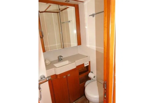 Slide: The Image of Bathroom interior of 2014 Tayana Isara 50 yacht with wooden cabinetry and modern fixtures. - 46