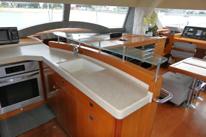 Slide: The Image of Luxurious 2014 Tayana Isara 50 yacht interior with modern kitchen and navigation area. - 5
